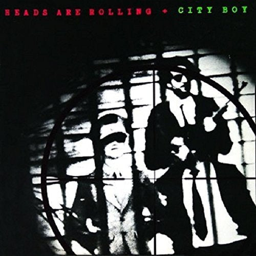 "Album cover with silhouetted figures behind bars, 'Heads Are Rolling' and 'City Boy' text."