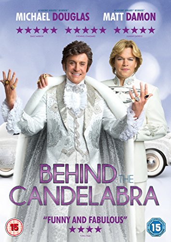 DVD cover for "Behind the Candelabra" featuring Michael Douglas and Matt Damon in white attire.