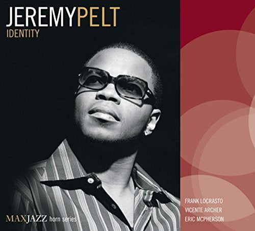 "Album cover featuring a black-and-white photo of Jeremy Pelt with trumpet, against a red background."