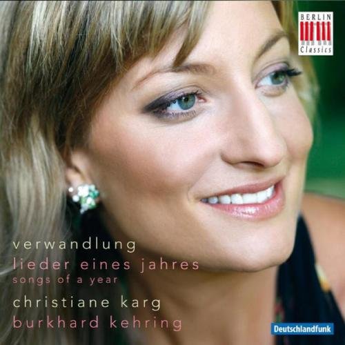 "Album cover featuring a smiling woman with blonde hair and green eyes."