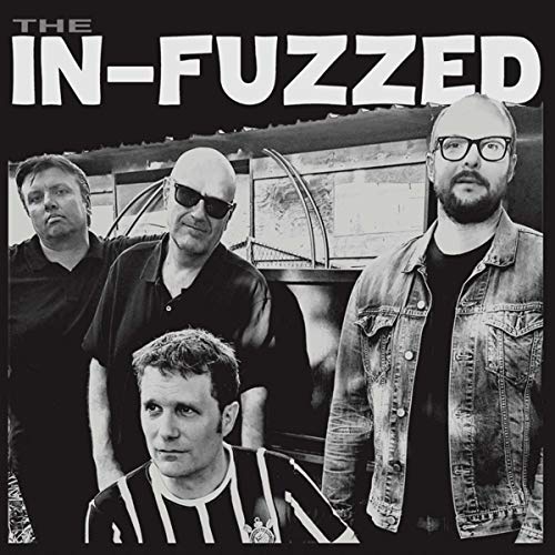 Black and white album cover featuring four men standing in front of a building.