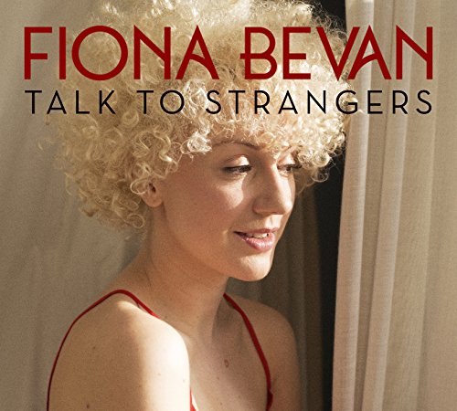 Album cover featuring a woman with curly blonde hair, wearing a red top, beside a curtain.