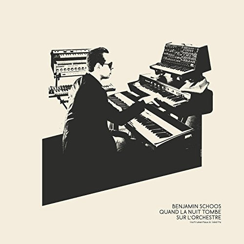 Black and white album cover featuring a man playing multiple keyboards.