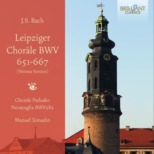 "CD cover featuring a tall, old clock tower against a blue sky."