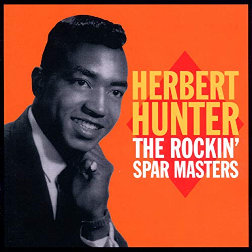 Album cover with black-and-white portrait of man against an orange background.