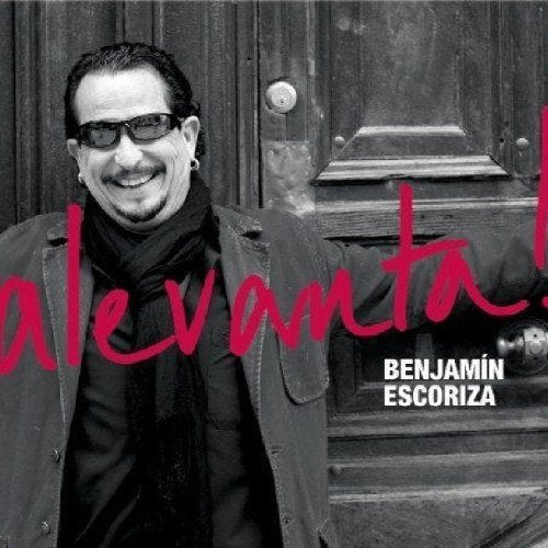 "CD cover with a man in black and white, red text overlay."