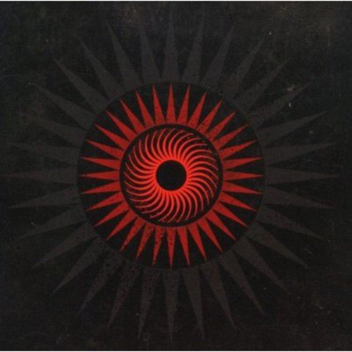 The image is a black square with a red and black circular design. Alt text: Black album cover with red and black spiral sunburst design.