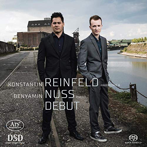 "Album cover featuring two men in suits standing on a railway by a river."