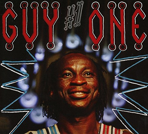 Album cover with a smiling man and red stylized text "Guy One" on a black background.