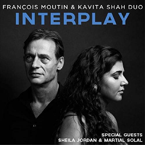 "Album cover with black and white photo of man and woman, titled 'Interplay'."