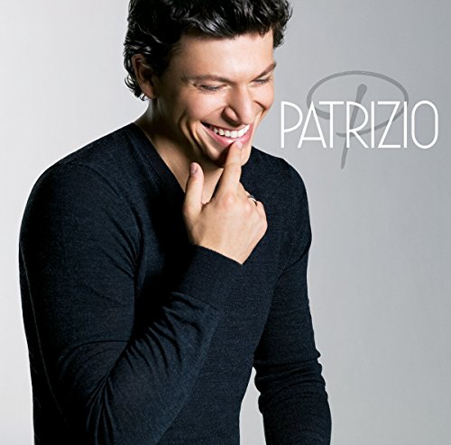 Man in black shirt smiles, hand to chin, with "PATRIZIO" text beside him.