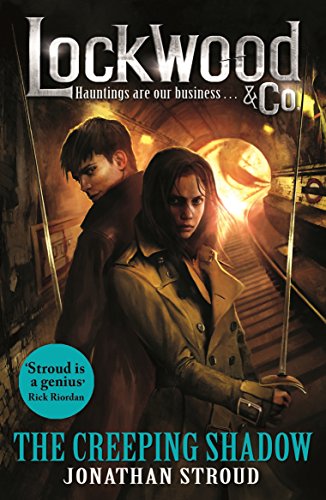 Book cover featuring a man and woman holding ghost-hunting equipment, with a ghostly figure behind.