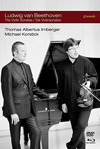 Black and white image of pianist and violinist beside a piano on a DVD cover.