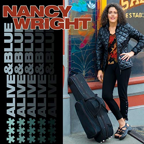 "Album cover with woman standing beside guitar case, 'Nancy Wright Alive & Blue' title."