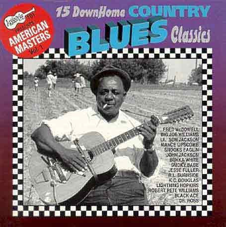 "CD cover with black and white photo of man playing guitar outdoors."