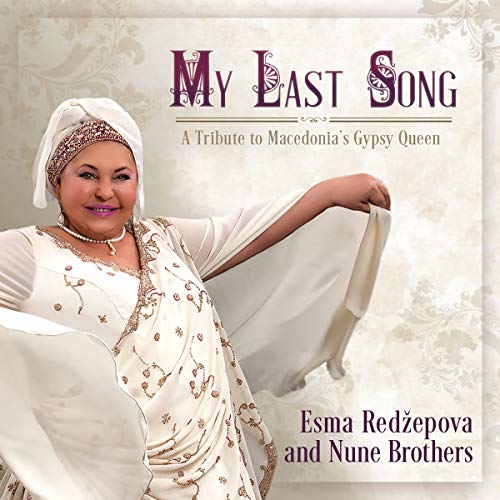 "CD cover featuring a woman in traditional dress with ornate background."