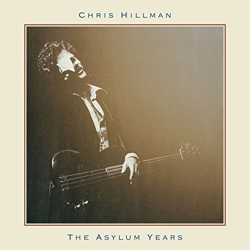 Album cover with a man playing a bass guitar, sepia-toned photograph.