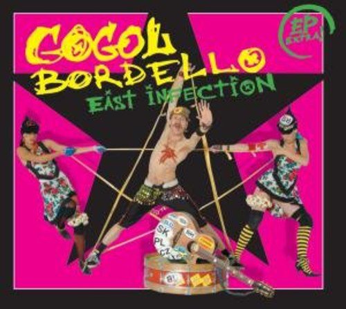 "Album cover with three performers and a suitcase on a pink and black background."