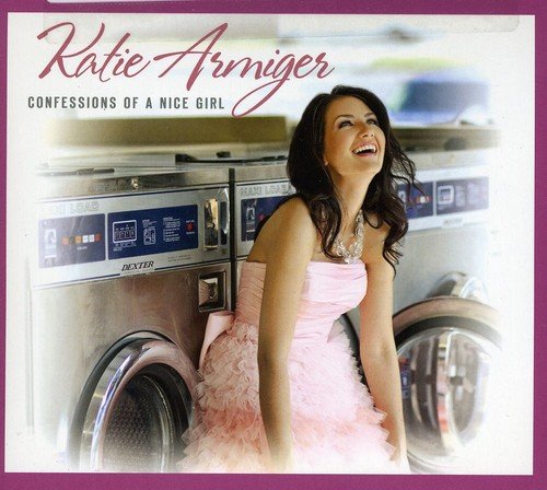 Album cover with woman in pink dress sitting between washing machines, smiling.