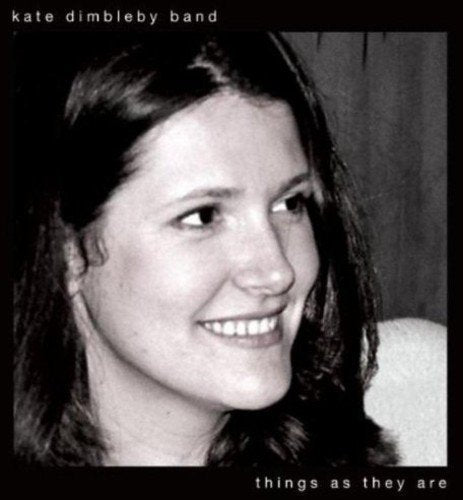 Black and white CD cover featuring a smiling woman with long dark hair.