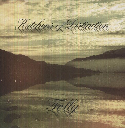 Vinyl album cover featuring a serene lake scene with mountains and cloudy sky.