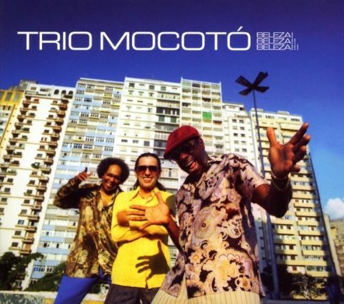 "Album cover featuring three men posing in front of a tall building."