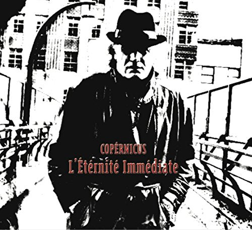 "Album cover with a black and white man in a hat on a bridge."