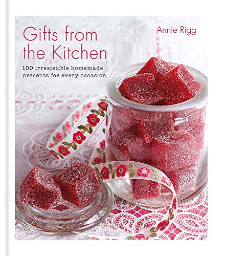"Book cover with a jar of red candies on a lace tablecloth."