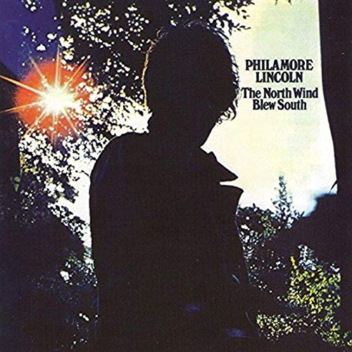 Album cover with silhouette of a man against a bright, starry background with text.