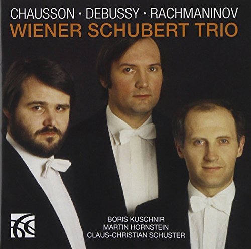 CD cover featuring three men in black tuxedos against a dark background.