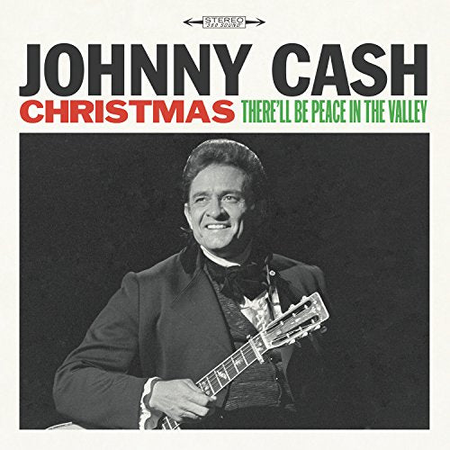 Johnny Cash album cover with black-and-white photo of him holding a guitar.