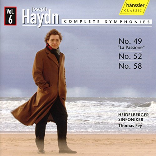 Man in brown coat on beach with waves, Haydn symphonies CD cover.