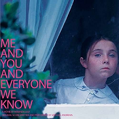 "Album cover with a young girl looking out a window, text on the left."