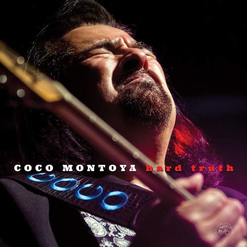 Man playing guitar with eyes closed, head tilted back, on album cover.