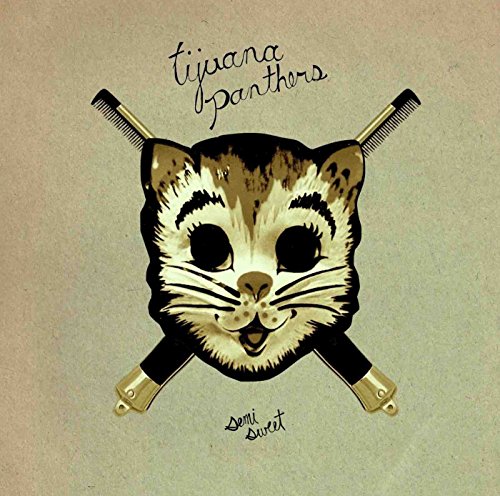 "Album cover featuring a stylized cat face with crossed combs, beige background, and cursive text."