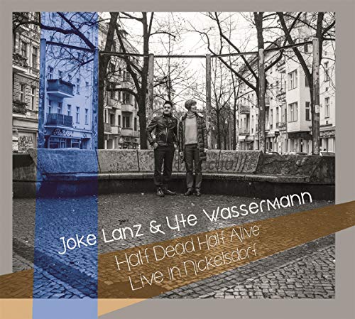 Album cover with two men standing on a cobblestone street, layered with blue and brown graphics.