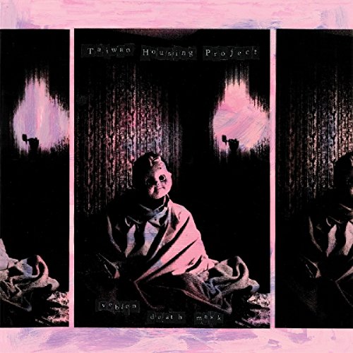 "Album cover with a person wearing a mask, wrapped in fabric, in a dark setting."