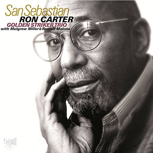 Black and white CD cover featuring a man with glasses and a thoughtful expression.