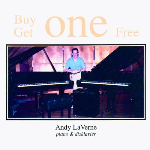 "CD cover featuring a man standing between two grand pianos, wearing a blue shirt."