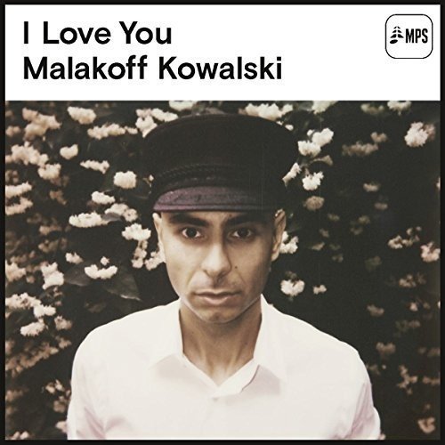 Vinyl album cover featuring a man in a white shirt and cap.