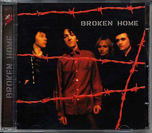 "Album cover with four men behind barbed wire, titled 'Broken Home'."