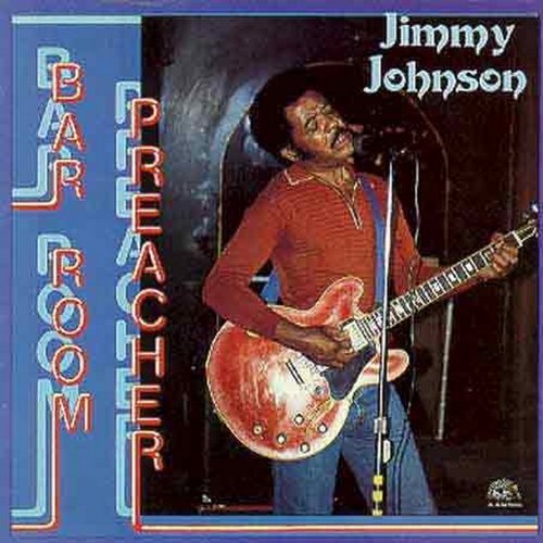 "Album cover with man playing guitar and singing into a microphone."