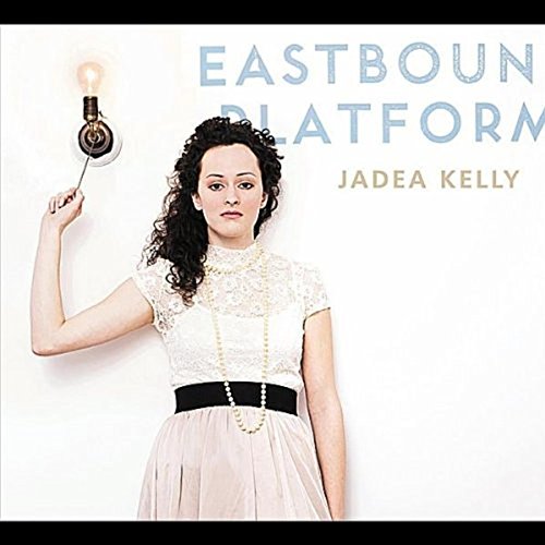 Woman in white dress holding a light bulb on a stick, album cover.