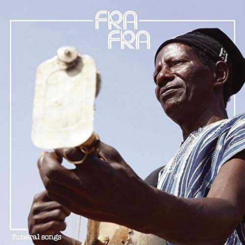 The image is a vinyl album cover. #### Alt text: Man in striped shirt and head wrap playing a stringed instrument against a blue background.