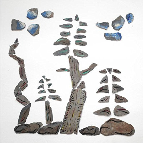 The image depicts a tree made from broken slate pieces on Page Page Background.