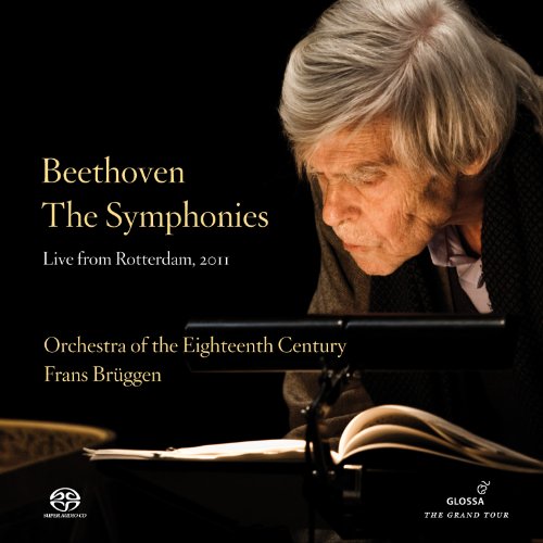"Album cover with elderly man reading sheet music on a stand against a black background."