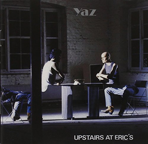 CD cover: two men seated in a dimly lit, sparse room.