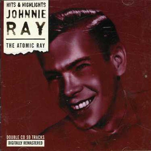 "CD cover with a smiling man and 'Johnnie Ray' text on a red background."