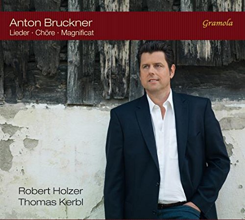 CD cover featuring a man in a suit against a weathered wooden wall.