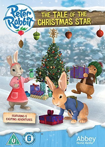 DVD cover featuring Peter Rabbit and friends decorating a Christmas tree in a snowy scene.
